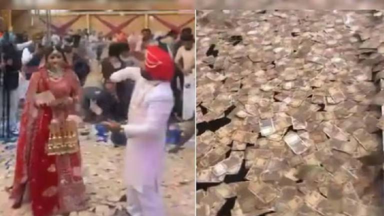 guests showering currency notes on the newly married couple