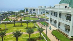 Visual representation of a massive high-tech data center planned near Visakhapatnam by Google alongside the luxury mansion at Rishikonda