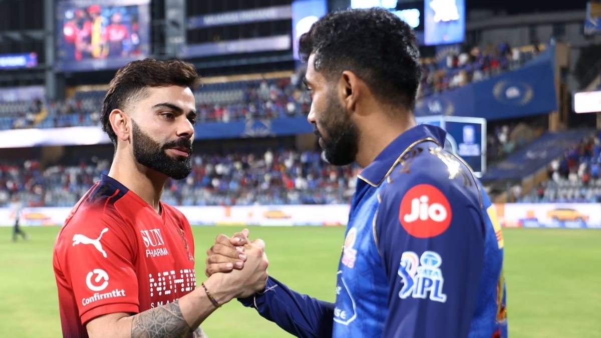 Virat Kohli and Phil Salt celebrating their partnership during RCB vs MI IPL 2026 match at Wankhede Stadium.